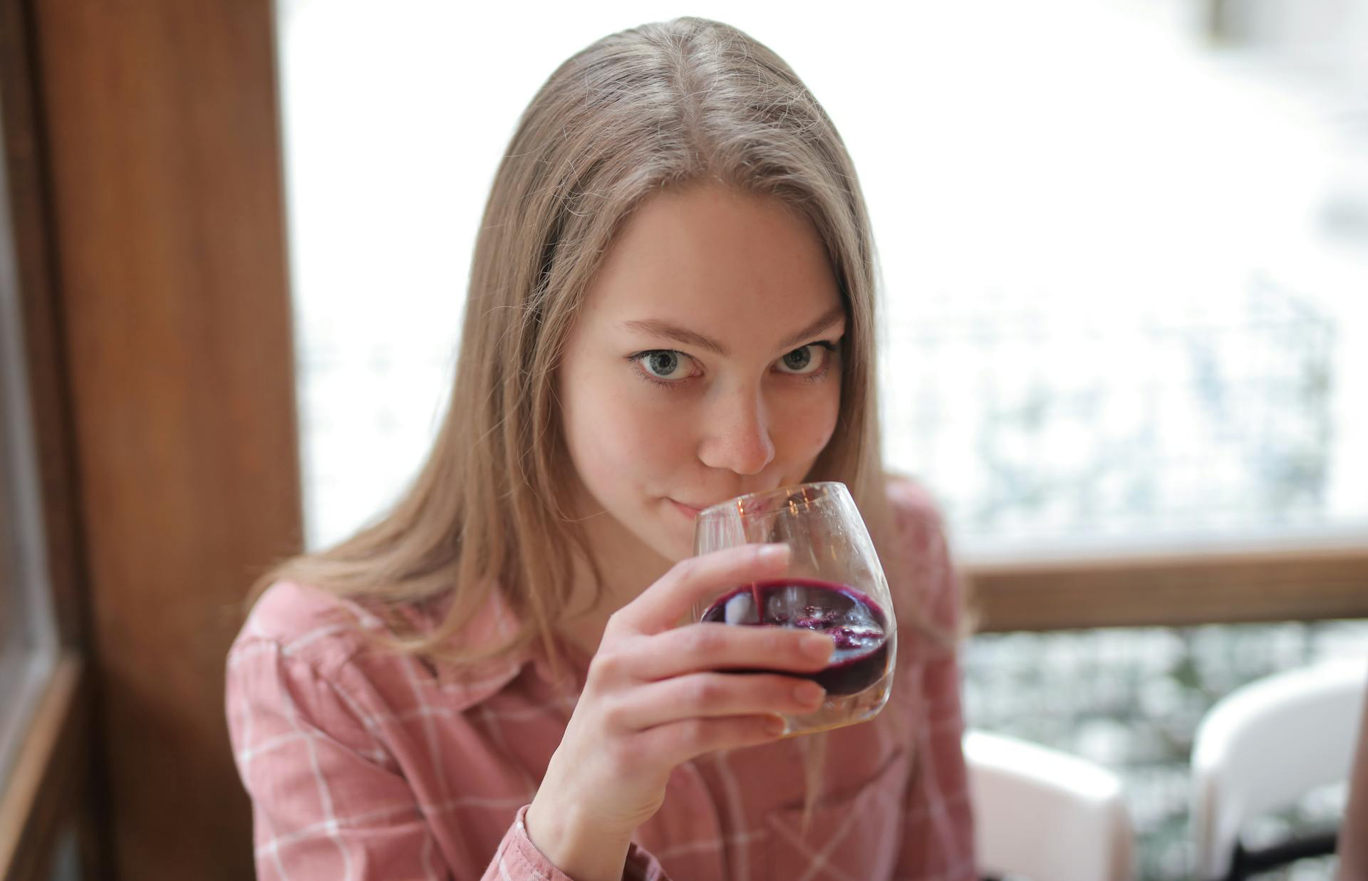 Women drinking Haskap juice at home