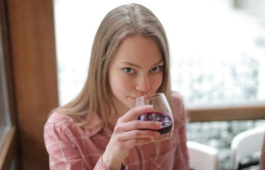 Women drinking Haskap juice at home