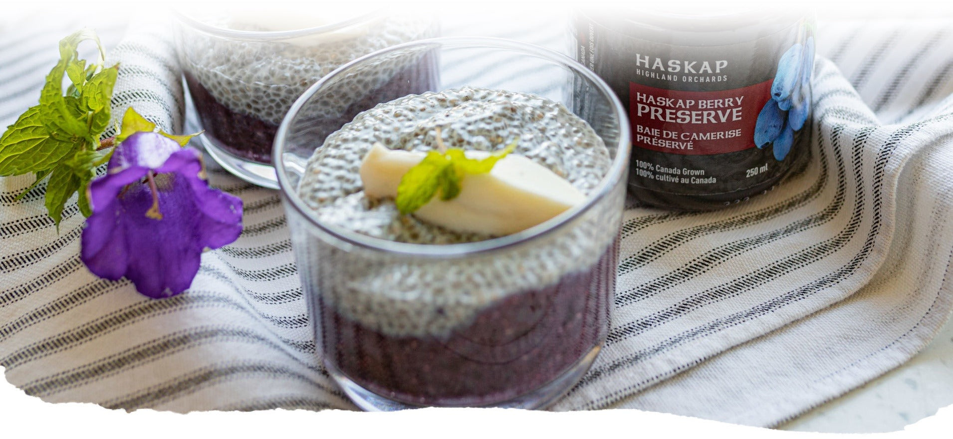 Tablecloth with Haskap berry chia pudding and Haskap berry preserve from Haskap Highland Orchards